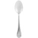 A close up of a Libbey stainless steel teaspoon with a white background.