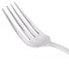 A close-up of a Libbey Baguette II stainless steel dinner fork with a white background.