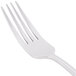 A World Tableware Varese stainless steel utility/dessert fork with a white handle.