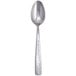 A close up of a Libbey stainless steel teaspoon with a patterned handle.