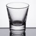 A close-up of a Libbey clear shot glass.