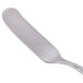 A silver butter spreader with a handle.