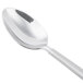A close-up of a Libbey stainless steel dessert spoon with a handle.