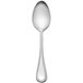A Libbey stainless steel serving spoon with a round handle on a white background.