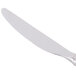 A Libbey stainless steel dinner knife with a silver handle.