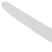 A close-up of a Libbey Madison stainless steel dinner knife with a sharp blade.