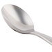 A World Tableware stainless steel teaspoon with a silver handle.