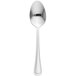 A close up of a Libbey stainless steel dessert spoon with a white handle.