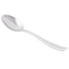 A silver Libbey dessert spoon with a white background.