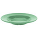 A close up of a green GET Diamond Mardi Gras melamine bowl with a white rim.