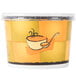 A yellow and orange Huhtamaki paper container with a spoon and a bowl of soup.