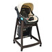 A Koala Kare brown plastic high chair with a black seat and casters.