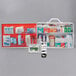 A red and white Medique Class B first aid kit cabinet with various items inside.