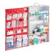A large, wall-mounted first aid kit cabinet with multiple shelves and compartments containing various medical supplies and medications.