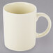 A white porcelain mug with a c-handle.