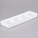 An ultra bright white rectangular porcelain tray with four compartments.