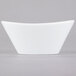A Libbey Chef's Selection II white porcelain bowl with a small handle.