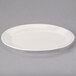 An ivory oval Libbey porcelain platter with a rim.