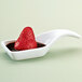 A strawberry in a Libbey ultra bright white porcelain tasting spoon.
