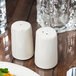 A table set with Libbey Farmhouse ivory porcelain salt and pepper shakers.