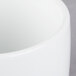 A close up of a Libbey Ultra Bright White Porcelain Canne Bowl with a white rim.