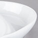 A Libbey white porcelain divided platter with a curved edge.