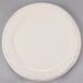 A white Libbey porcelain plate with a brown rim.