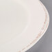 A Libbey Farmhouse medium rim porcelain plate with a brown rim.