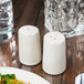A table set with a salad and Libbey Farmhouse ivory salt and pepper shakers.