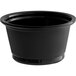 A black Choice plastic souffle cup on a table.