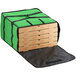 A green Choice insulated pizza delivery bag holding four large pizza boxes.