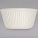 A white Carlisle fluted ramekin with a ribbed pattern on a white surface.