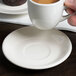 Choice 4 7/8" Ivory (American White) Rolled Edge Stoneware Saucer - 36/Case Main Thumbnail 1
