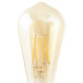 A Satco ST19 LED light bulb with a filament inside and clear glass cover over yellow wires.