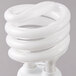 A white spiral Satco light bulb.