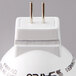 A close up of a Satco 3 watt white narrow flood LED light bulb with a plug.