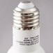 A close up of a Satco Warm White LED Reflector Light Bulb with a white label.