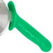 A Dexter-Russell pizza cutter with a green handle.