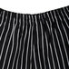 A close up of a pair of black and white striped Chef Revival chef pants.