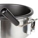 A stainless steel Carnival King 8 oz. popcorn kettle with a black handle.