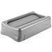 A Rubbermaid gray rectangular plastic lid with a handle.