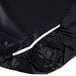 A black plastic tablecloth with white elastic edges.