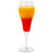 A Libbey tulip champagne glass filled with red liquid on a white background.