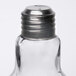 An American Metalcraft glass lightbulb salt shaker with a silver lid.