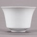 A CAC Citysquare bright white porcelain cup with a white rim on a gray surface.