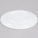 An Elite Global Solutions white melamine plate on a gray surface.