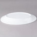 An Elite Global Solutions white oval melamine plate on a gray surface.