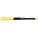 A yellow and black silicone brush with saw tooth edges on the tip.
