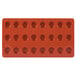 A red silicone round tray with 24 compartments.