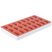 A red and white Martellato silicone tangerine slice mold with 24 compartments.